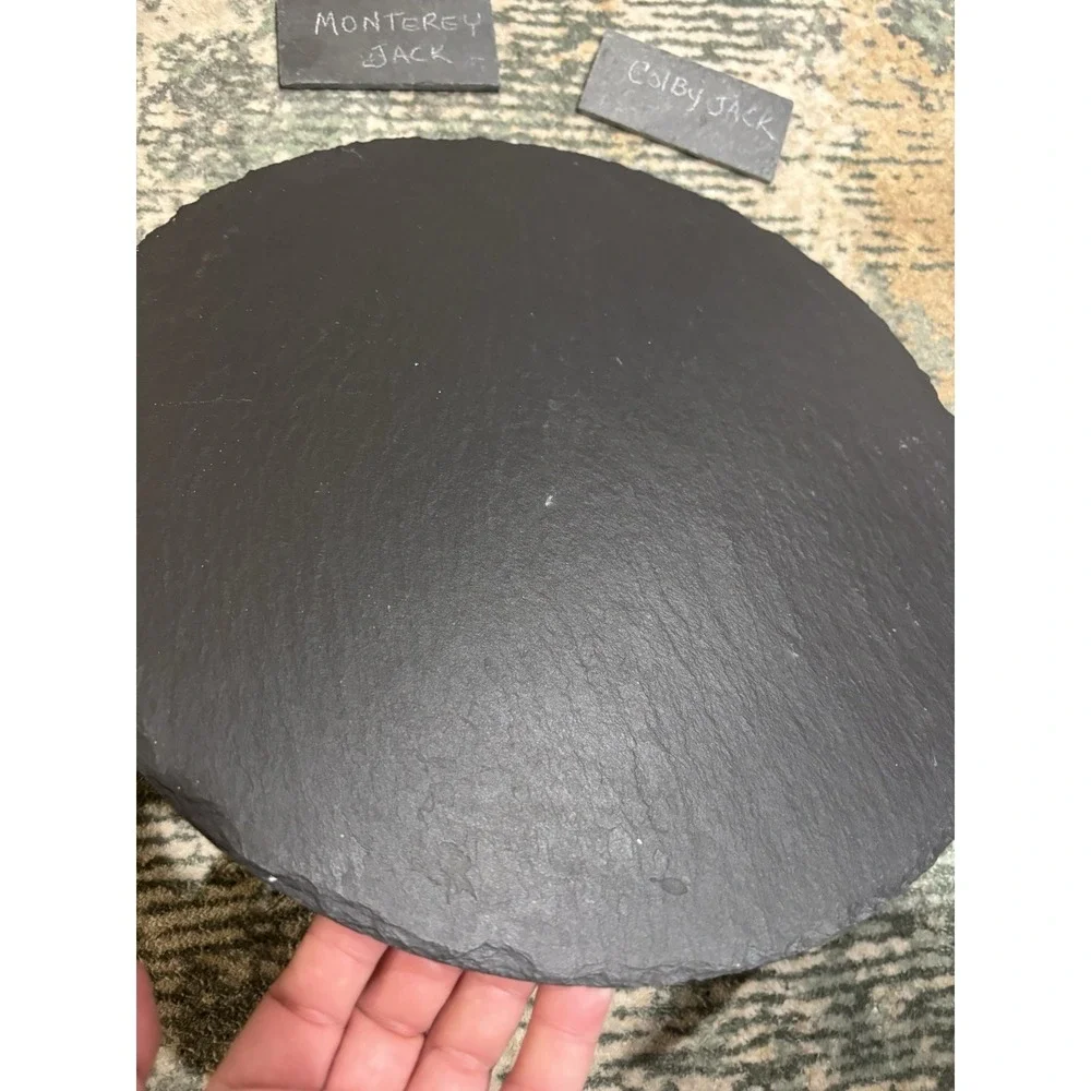 Large Slate Charcuterie Board On A Lazy Susan With Serving Utensils And Placards